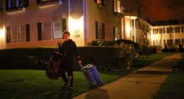 A man leaves after an evacuation order as a wildfire burns in the Pacific Palisades neighborhood of west Los Angeles on January 7.