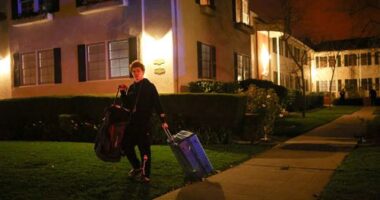 A man leaves after an evacuation order as a wildfire burns in the Pacific Palisades neighborhood of west Los Angeles on January 7.