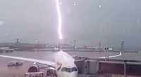 Watch as British Airways plane is struck by lightning & cars are swept away as devastating floods wreak havoc in Brazil