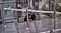 Watch moment woman crawls under airport security barrier before sneaking onto PLANE completely unnoticed