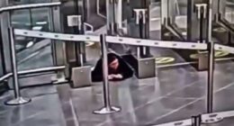 Watch moment woman crawls under airport security barrier before sneaking onto PLANE completely unnoticed