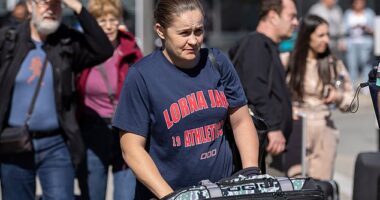 Ash Barty was pictured at Queenstown Airport with husband Garry and their son Hayden