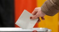 Conservative candidate pulls ahead in German election, according to early exit polls