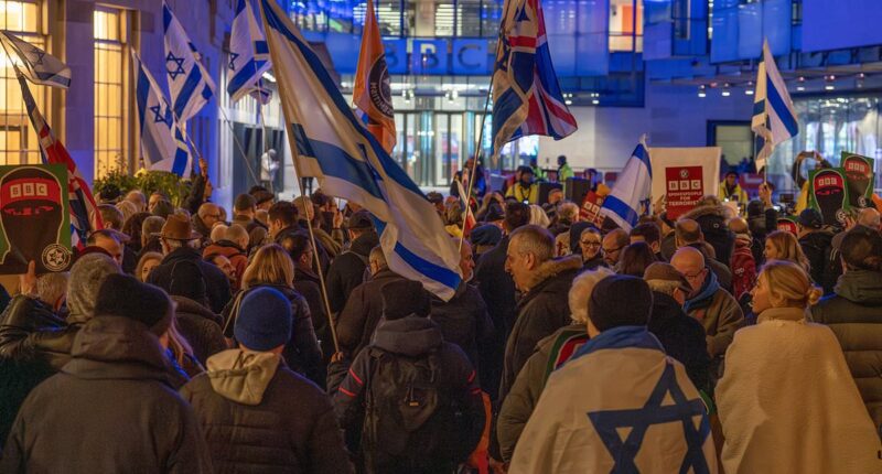 Dozens of protestors swarm the BBC headquarters after the broadcaster 'spent more than £400,000 on a Gaza documentary which featured Hamas leader's son'