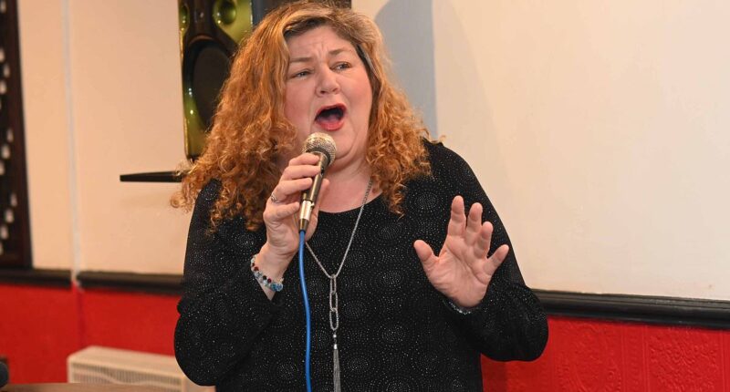 EastEnders star Cheryl Fergison reveals she 'couldn't be happier' after unexpected career change as she puts on a show at local Chinese takeaway