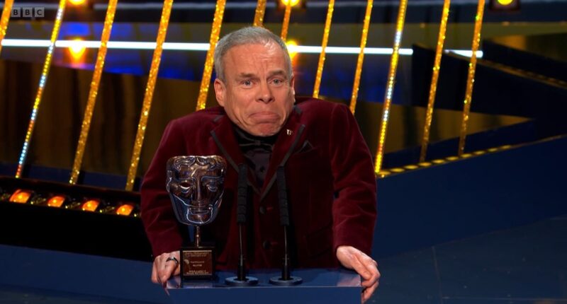 Emotional Warwick Davis fights back tears as he pays tribute to his late wife Samantha and admits he has found love again while accepting the Fellowship Award at the BAFTAs