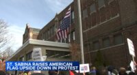 Father Michael Pfleger flies American flag upside-down outside Saint Sabina Church in Gresham, Chicago