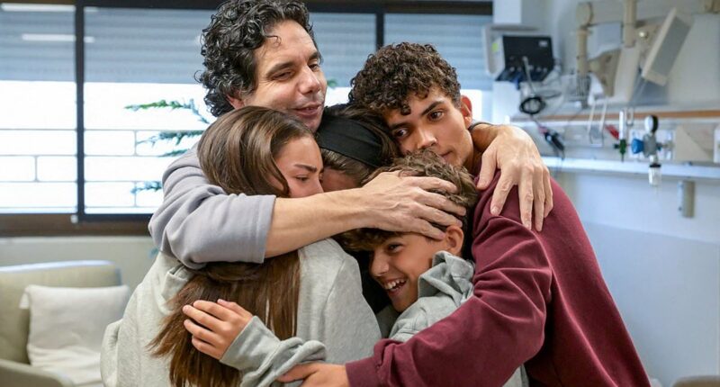 Freed hostages receive emotional hugs from delighted families but there's still no word on whether Hamas' youngest prisoners survived ordeal