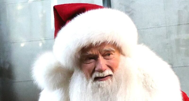 Hollywood star looks unrecognisable as he rocks Santa costume while filming scenes for new Christmas movie - but do YOU know who it is?