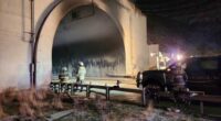 Investigators enter a highway tunnel in Wyoming where a fiery crash killed 2