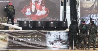 Israel braces for its saddest day: Hamas terrorists stand over four coffins as they hand over the bodies of October 7 hostages Shiri Bibas and her son Ariel and baby Kfir