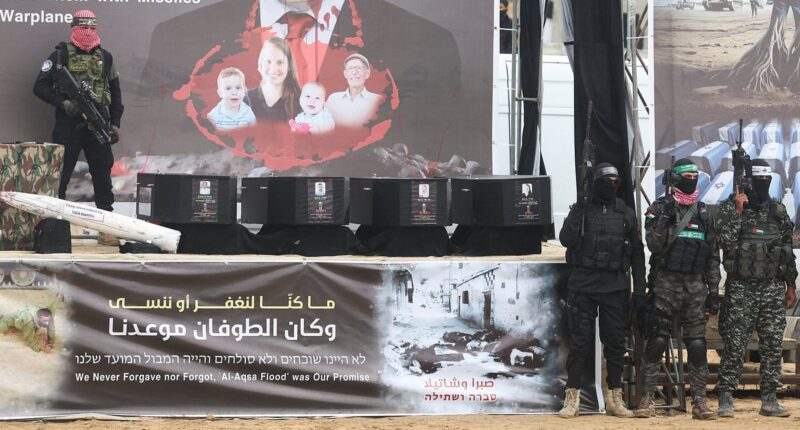 Israel braces for its saddest day: Hamas terrorists stand over four coffins as they hand over the bodies of October 7 hostages Shiri Bibas and her son Ariel and baby Kfir