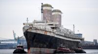 Legendary abandoned cruise ship SS United States left to rot for 30yrs makes final voyage before she is SUNK on purpose