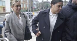 Chelsea and Australia soccer player Sam Kerr, right, arrives with partner Kristie Mewis at Kingston Crown Court, London.