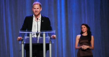 Meghan looks on lovingly as Prince Harry opens Invictus Games in front of whooping Vancouver crowd as he beams: 'What a beautiful sight!'