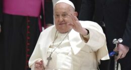 Pope Francis waves as he arrives for his weekly general audience in the Paul VI Hall, at the Vatican in February.