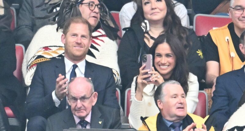 Prince Harry, Meghan Markle Share Cute Jumbotron Moment at Invictus Games