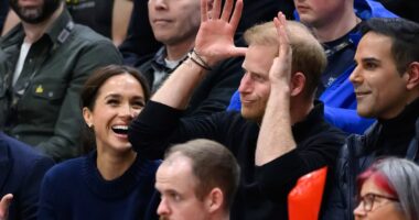 Prince Harry puts on goofy display with Meghan at the Invictus Games after his veiled swipe at Donald Trump following attack on 'terrible' wife