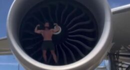 Shock moment bodybuilder influencer climbs into plane’s ENGINE to flex muscles and do push-ups in hugely dangerous stunt