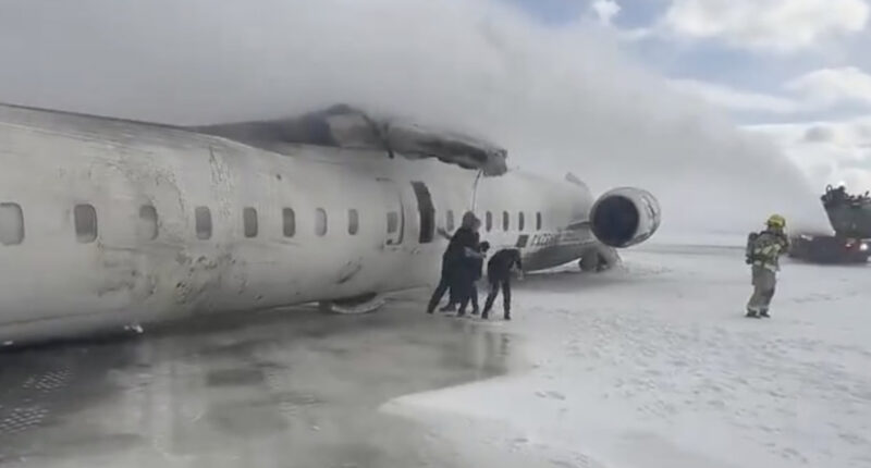 Shocking moment Delta plane crash passengers escape jet that flipped upside down on Toronto Pearson runway