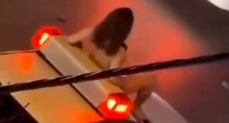 Shocking moment Iranian woman strips NAKED & leaps on cop car as she risks wrath of regime’s brutal ‘morality police’