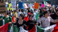 Thousands block traffic on LA freeway during Grammys ceremony in massive protest against Trump and migrant crackdown