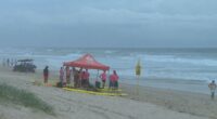 A young surf lifesaving trainee has been rushed to hospital after nearly drowning during a routine exercise on a Gold Coast beach.