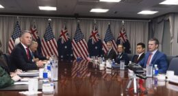 Secretary of Defense Pete Hegseth, right, welcomes Australian Deputy Prime Minister and Defense Minister Richard Marles, left, before the start of their meeting at the Pentagon, Friday, Feb. 7, 2025, in Washington. (AP Photo/Manuel Balce Ceneta)