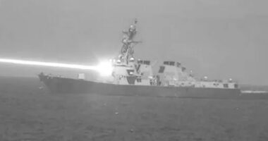 US Navy seen firing futuristic drone-destroying laser weapon dubbed ‘Helios’ from warship in incredible declassified pic