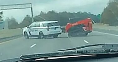 Watch moment devil-horned digger driver leads 15 cop cars on bizarre chase before smashing one with bucket & being shot