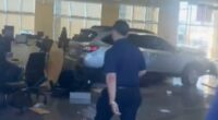 At least 8 injured as car plows into CarMax showroom in Los Angeles driven by angry customer