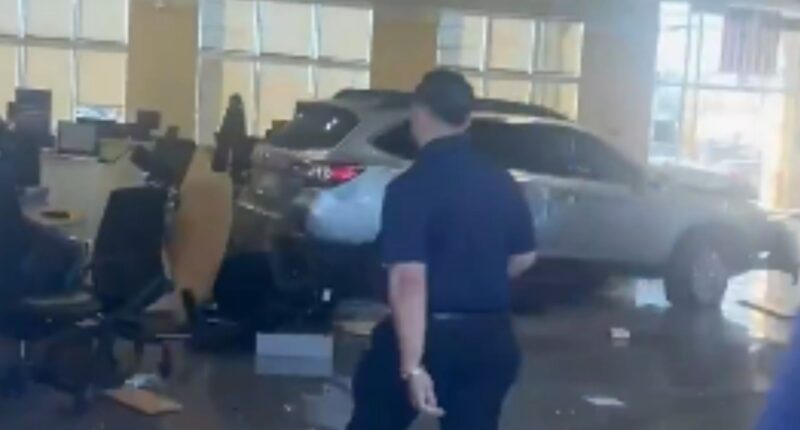 At least 8 injured as car plows into CarMax showroom in Los Angeles driven by angry customer