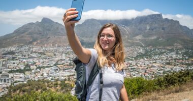 Cape Town becomes new anti-tourism flash point as activists condemn rise of selfie-taking digital nomads and holidaymakers are told 'stop coming to South Africa'