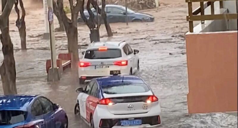 European holiday hot spot ravaged by flash floods as cars washed away and tourists warned to stay indoors