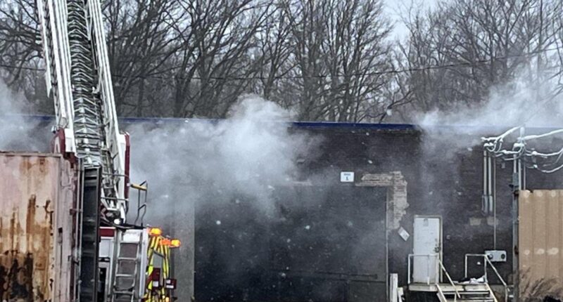 Fire crews battle blaze at industrial building on Coit Road in Cleveland