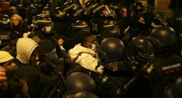 French riot cops clash with migrants as they FINALLY clear Paris theatre occupied by hundreds of homeless asylum seekers who were invited to a free show and stayed for weeks