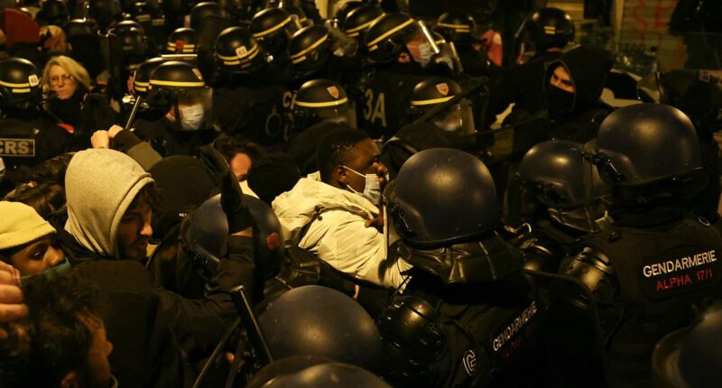 French riot cops clash with migrants as they FINALLY clear Paris theatre occupied by hundreds of homeless asylum seekers who were invited to a free show and stayed for weeks