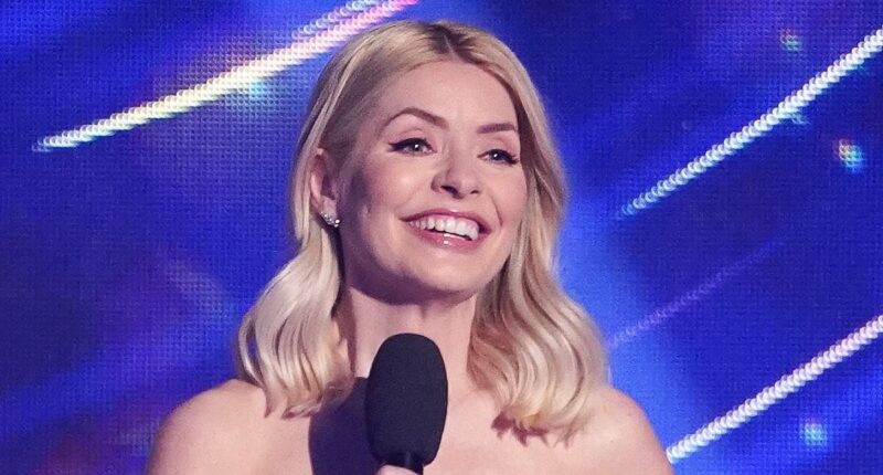 Holly Willoughby, 44, dazzles in an elegant white sequinned gown as she kicks off the Dancing On Ice Final amid doubts over the show's future