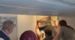 Horror moment crazed passenger tries to OPEN plane door during packed flight at 35,000ft as others rush to tackle him