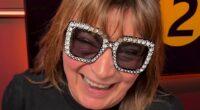 Lorraine Kelly attempts to hide her painful-looking black eye in Elton John style shades as she admits she 'feels silly' after disastrous fall at home