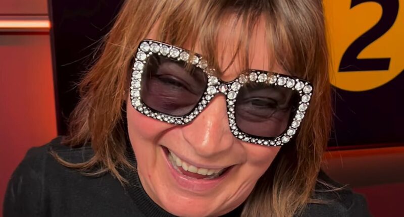 Lorraine Kelly attempts to hide her painful-looking black eye in Elton John style shades as she admits she 'feels silly' after disastrous fall at home