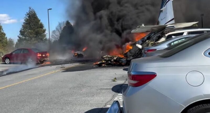 Plane crashes into retirement village parking lot & bursts into flames with emergency services rushing to the scene