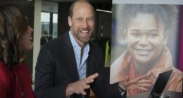 Prince William appears in cheerful spirits as he fires up a laptop during visit to a mental health charity close to his and Kate Middleton's hearts