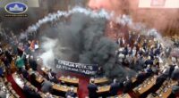 Serbian lawmakers throw smoke grenades, tear gas in parliament