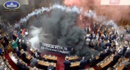 Serbian lawmakers throw smoke grenades, tear gas in parliament