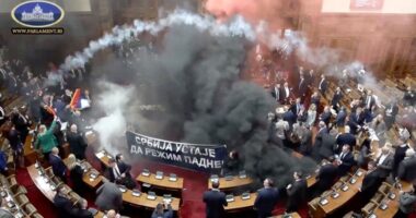 Serbian lawmakers throw smoke grenades, tear gas in parliament