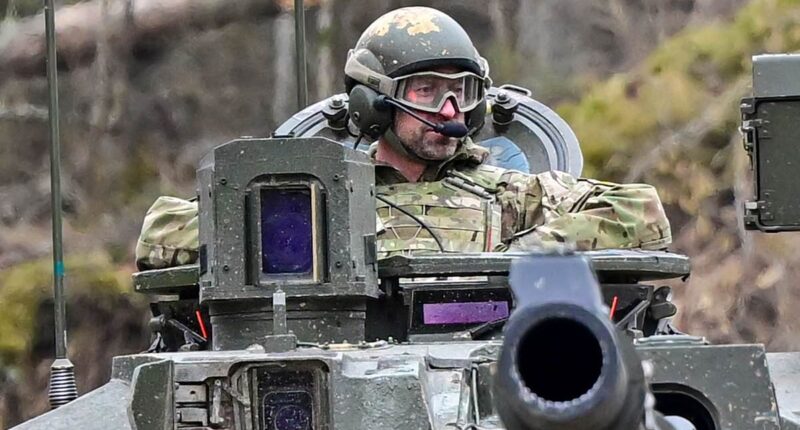 Tanks a lot! Prince William rides in British tank during visit to Nato base just 90 miles from Putin's Russia as he 'gets his hands dirty' in show of support for Estonia