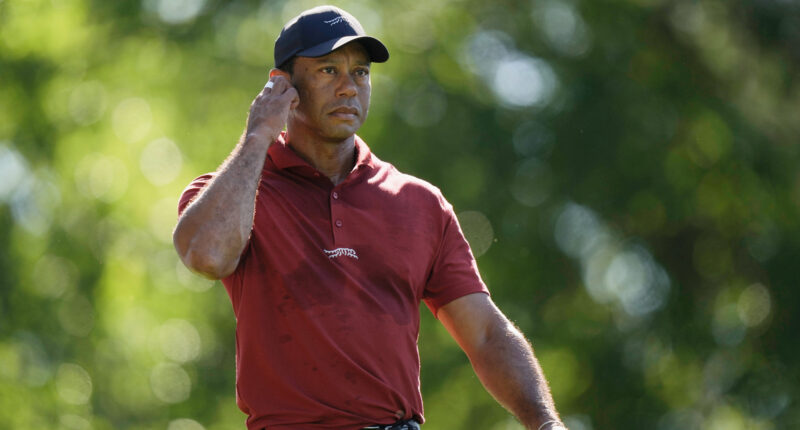 Tiger Woods says he ruptured his Achilles tendon, an injury that will keep him out of the Masters