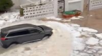 Watch moment Spanish holiday hotspot is flooded by river of ICE after hail storm as torrential rain batters region