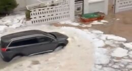 Watch moment Spanish holiday hotspot is flooded by river of ICE after hail storm as torrential rain batters region